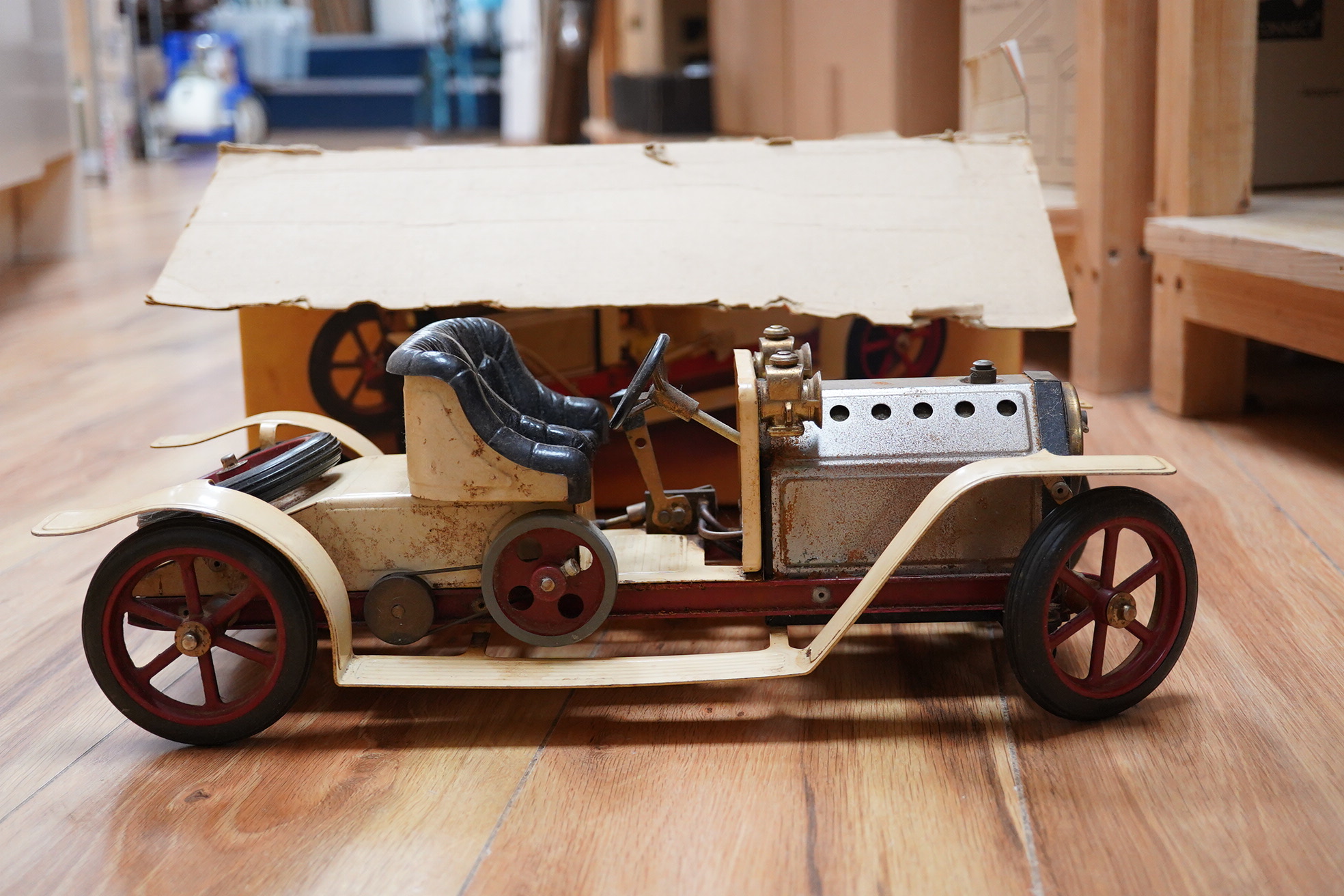 A boxed Mamod Steam Roadster, live steam, single cylinder cream painted car, together with some accessories